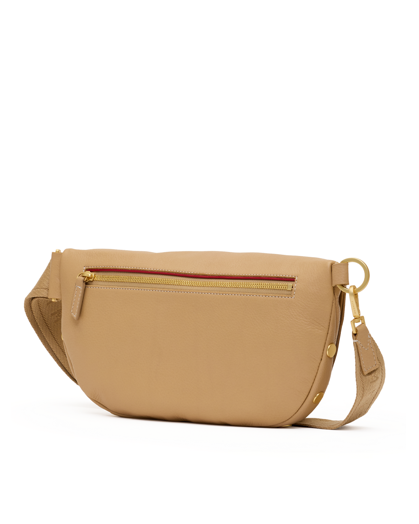 A tan leather crossbody bag with a gold-tone zipper, a thin red accent line along the zipper, and a matching tan leather strap with gold hardware, shown against a plain white background.