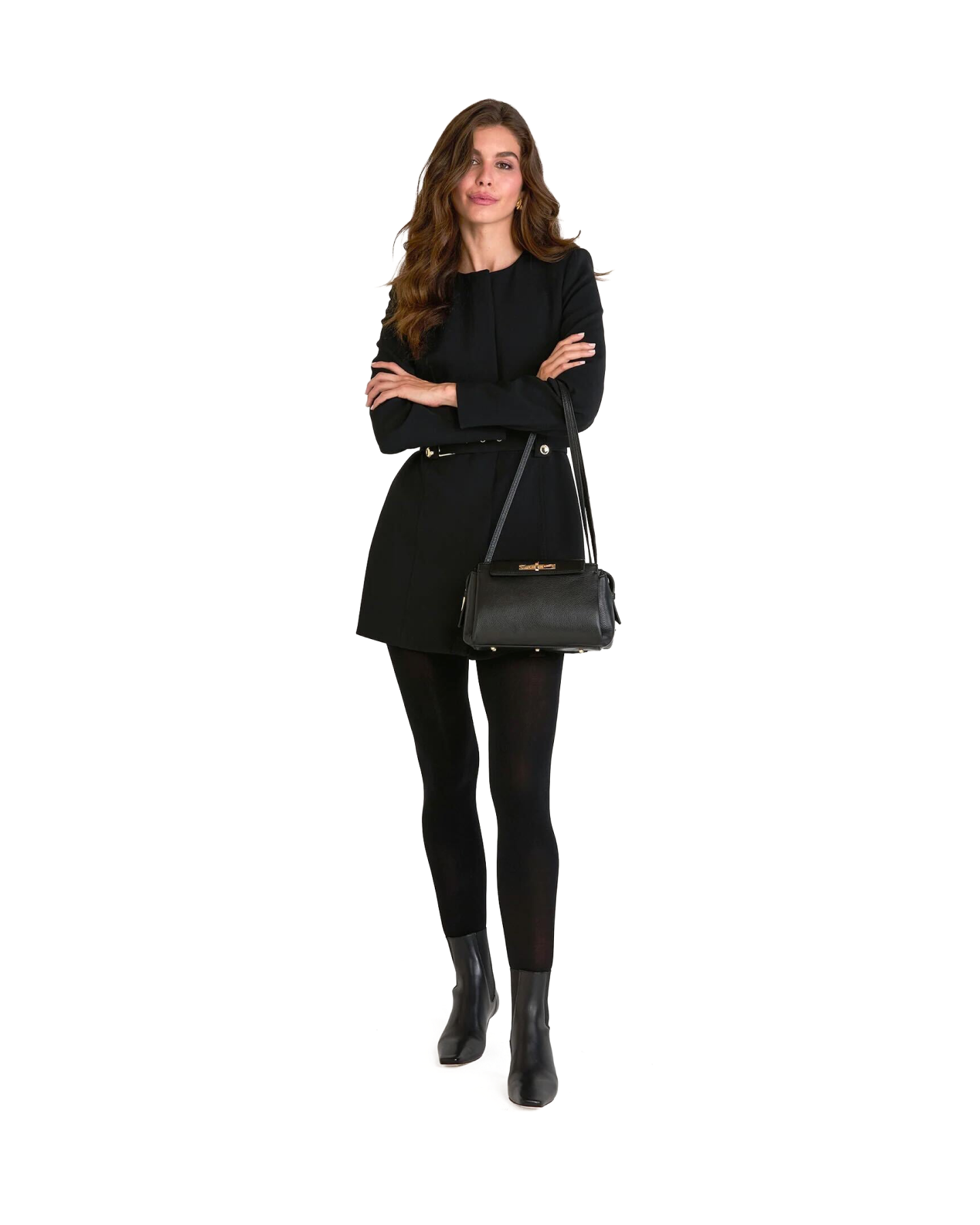 Woman in a black outfit holding a black handbag on a white background
