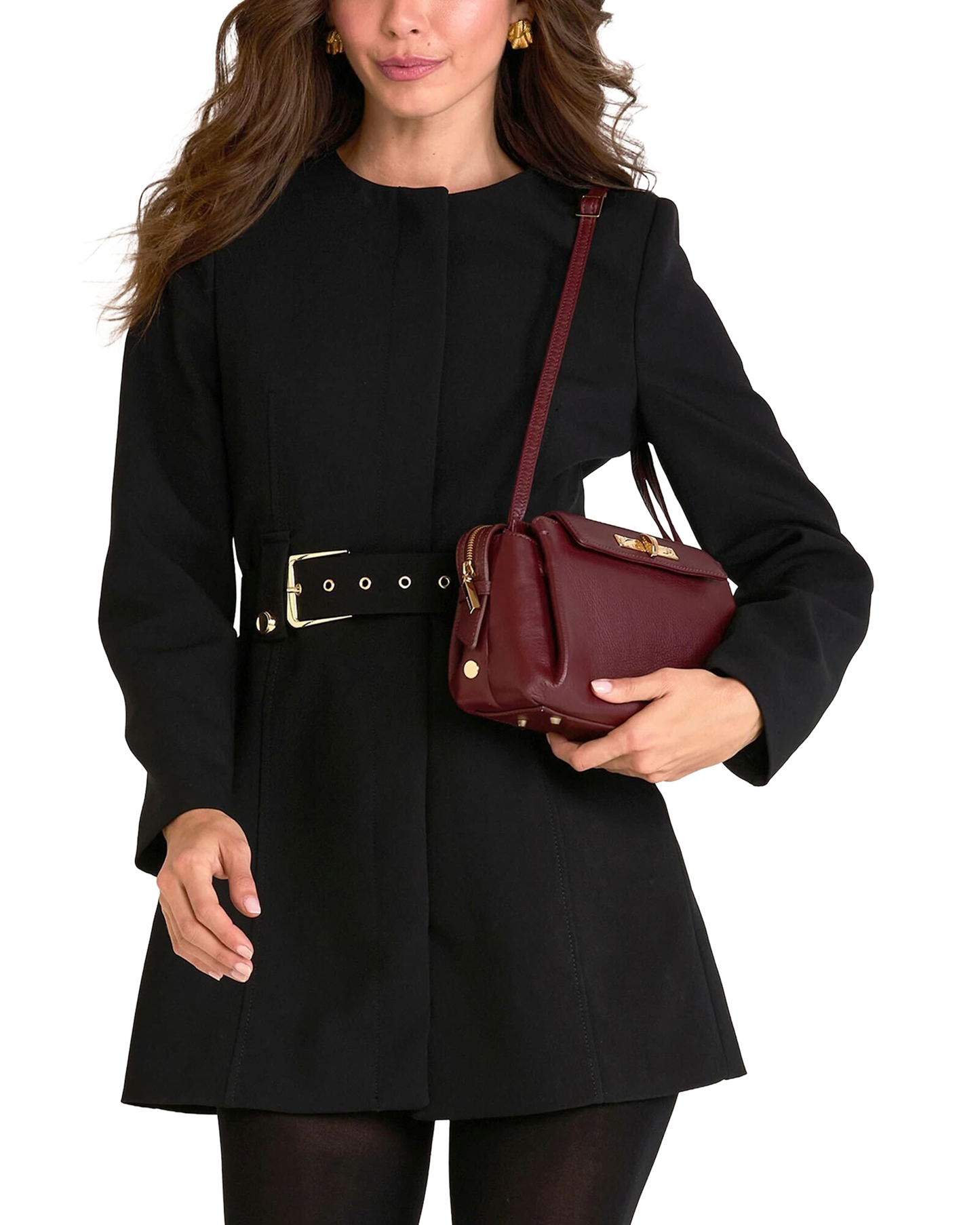 A woman wearing a black long-sleeve coat with a wide belt and holding a burgundy leather shoulder bag, shown against a plain white background.