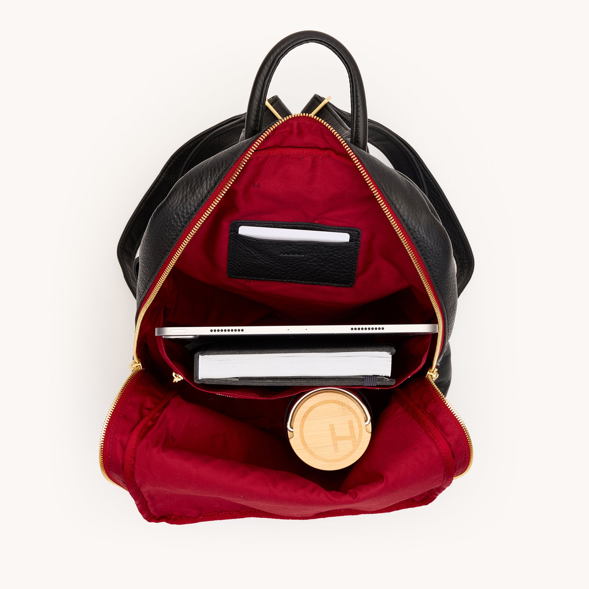 Hunter-Backpack-Black-BG-Red-Zip-Interior-View