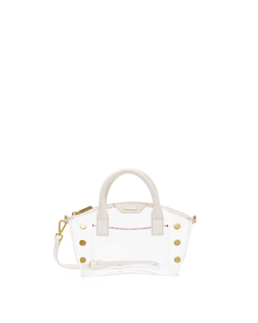 A clear acrylic handbag with white faux-leather trim, gold-tone hardware, and a white top handle.