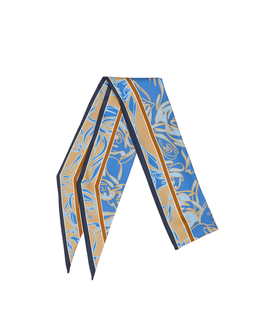 A folded silk scarf featuring a blue and beige abstract floral pattern with a thin orange stripe and dark navy borders, displayed on a clean white background.