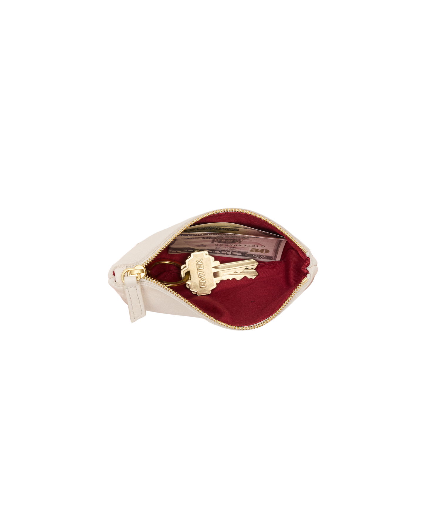 A cream-colored leather key pouch with a gold zipper, shown open to reveal a deep burgundy velvet interior containing a gold key and a card.