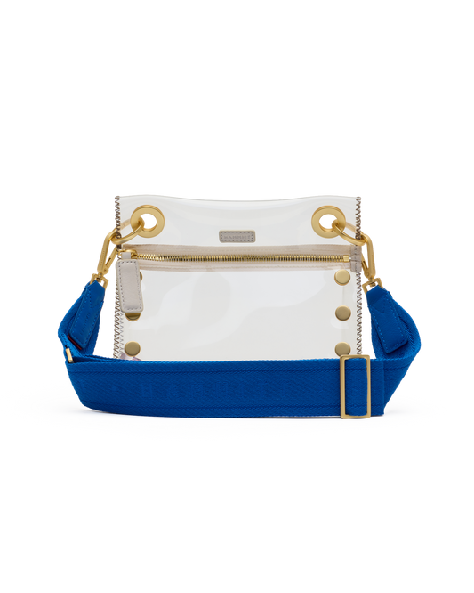 Clear handbag with blue strap and gold accents on a white background