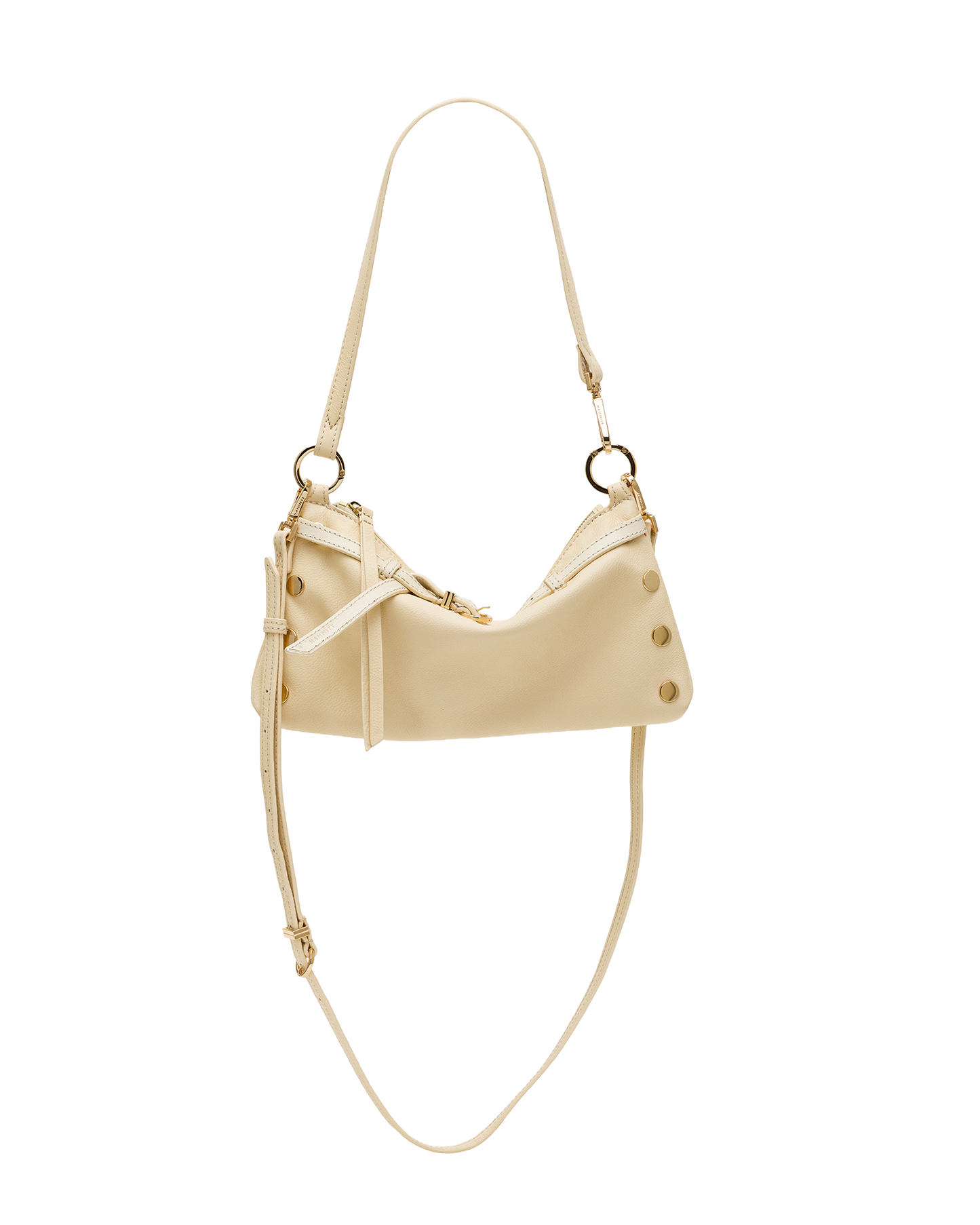 A cream-colored faux leather shoulder bag with gold-tone hardware, featuring a crescent-shaped body, decorative studs, and a long thin strap, shown against a plain white background.