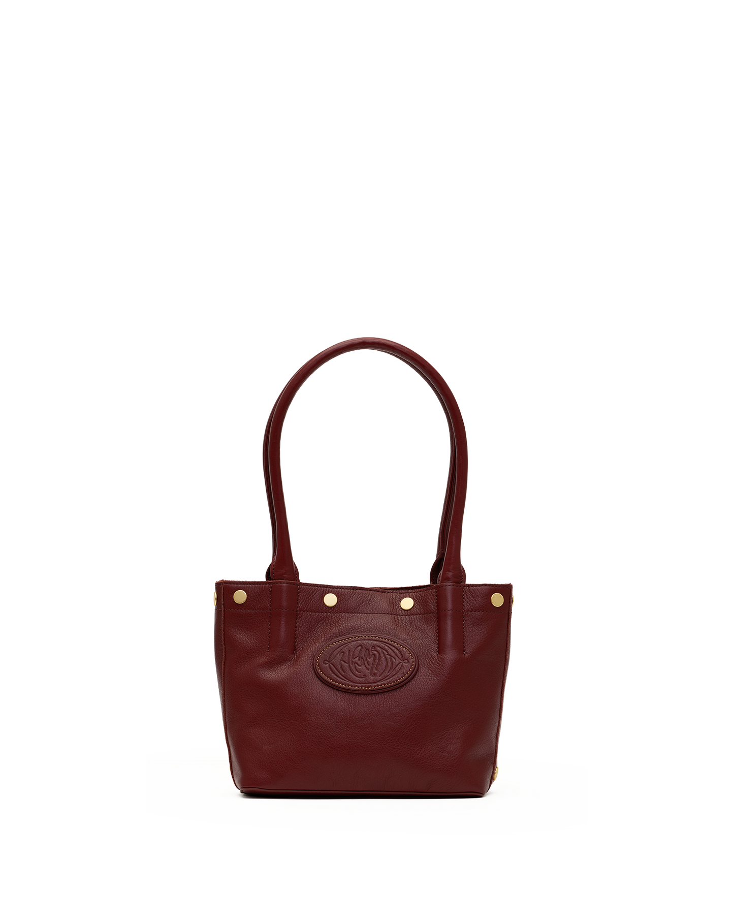 A dark burgundy leather tote bag with double top handles, gold-tone hardware, and an embossed oval logo on the front, shown against a plain white background.