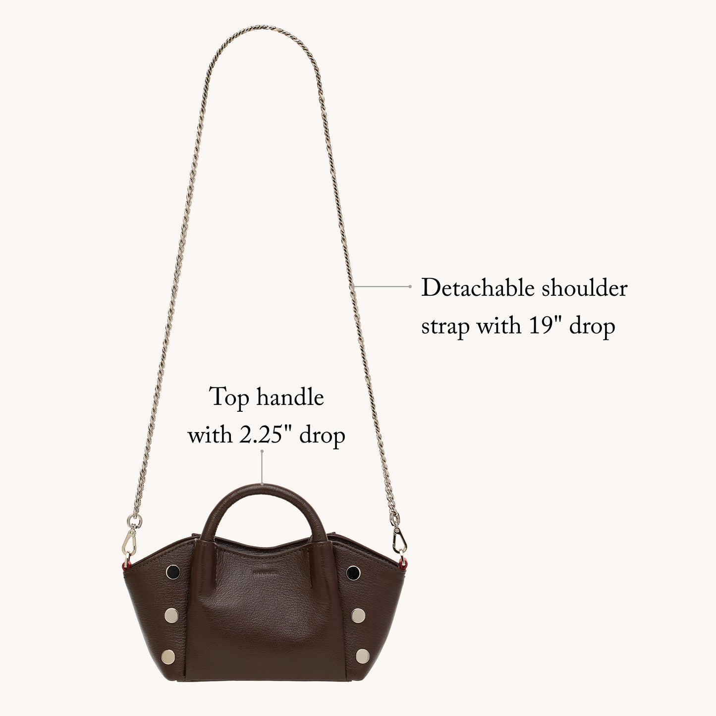 Brown handbag with detachable shoulder strap on a white background