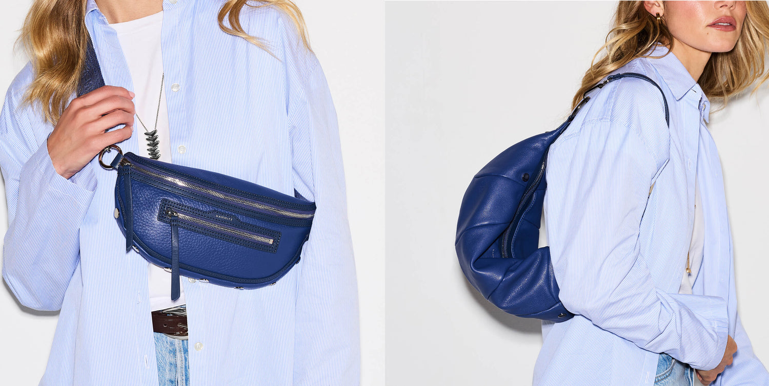 The image is split into two panels: the left shows a navy blue faux-leather fanny pack with silver studs and silver zippers, worn by a model in a blue button-down shirt with a white shirt under. The right shows a navy pebbled leather shoulder bag photographed on the same model. 
