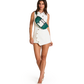 A woman modeling a white sleeveless double-breasted mini dress with gold buttons, accessorized with a green and white striped crossbody bag, on a solid white background.