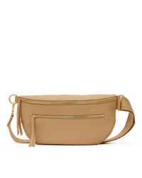 A tan leather waist bag with gold-tone hardware, featuring a top zipper, a front zip pocket, a tassel charm, and an adjustable shoulder strap, shown against a plain white background.