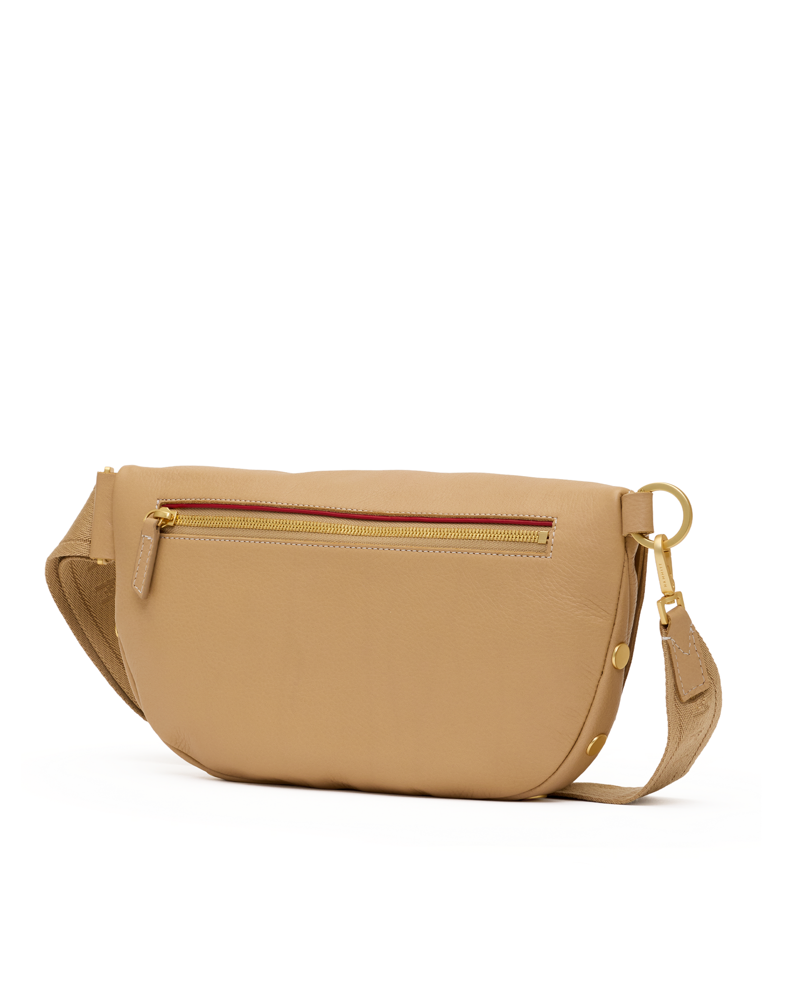 A tan leather crossbody bag with a gold-tone zipper, a thin red accent line along the zipper, and a matching tan leather strap with gold hardware, shown against a plain white background.