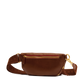 Brown leather fanny pack with gold zippers on a white background