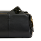 Black leather bag with a phone inside on a white background