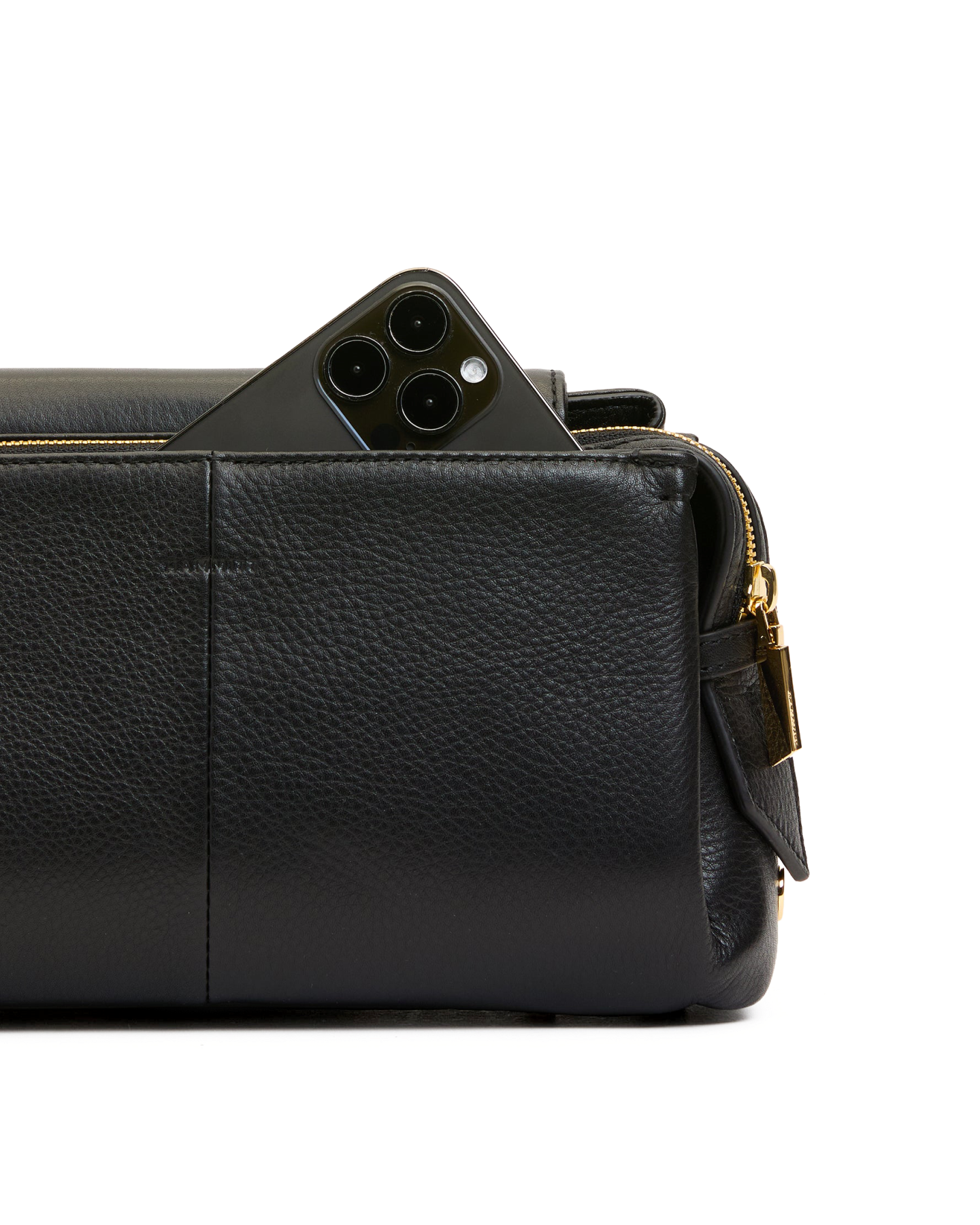 Black leather bag with a phone inside on a white background