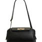 Black handbag with a gold clasp on a white background