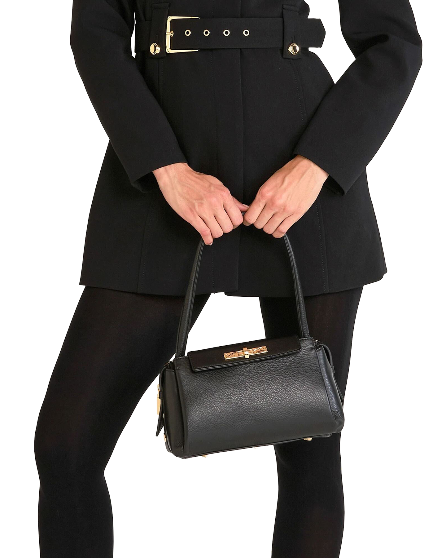 Person wearing a black coat and holding a matching black handbag on a white background