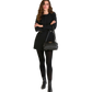 Woman in a black outfit holding a black handbag on a white background