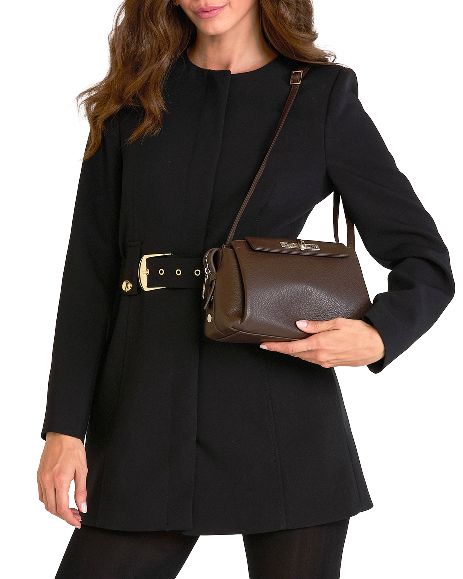 A woman wearing a black coat with a gold-tone belt buckle and carrying a dark brown leather shoulder bag.