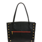 A black pebbled leather tote bag with gold-tone rivets and corner protectors, featuring dual top handles and a horizontal red zippered pocket on the front.