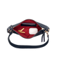 A navy blue shoulder bag shown open, revealing a bright red interior lining. Inside, there is a black card holder, a gold key, and a white wireless earbud charging case.