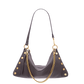 A dark brown leather crescent-shaped shoulder bag with gold-tone studs and a gold chain strap, shown against a plain white background.