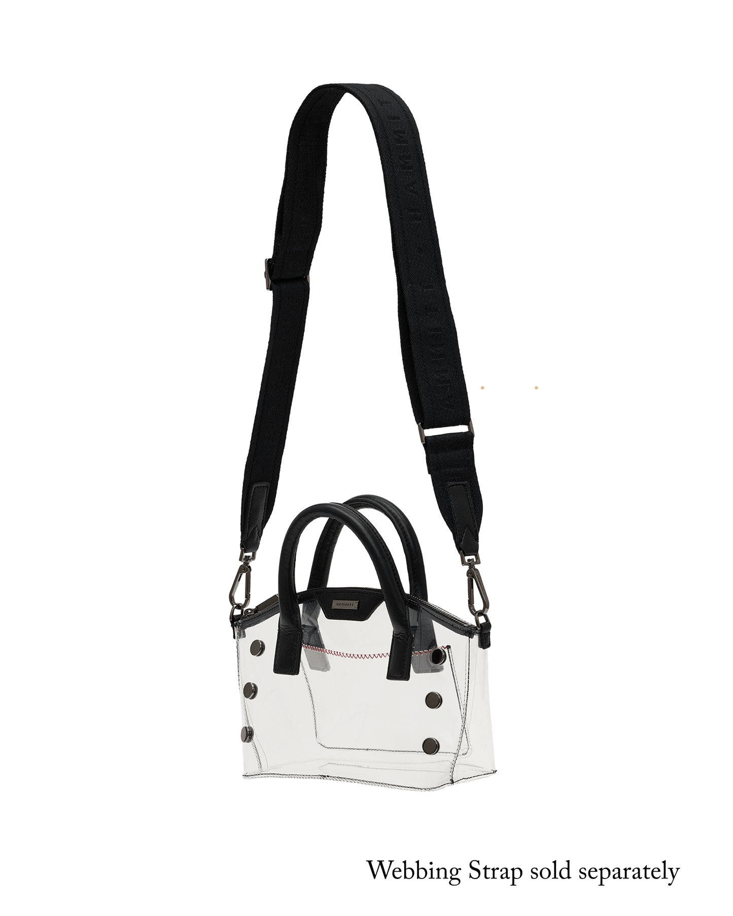 A structured white handbag with black handles, black snap details, and a long black shoulder strap.