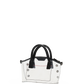A clear transparent tote bag with black double top handles, black trim, and silver-tone metal studs, shown against a plain white background.