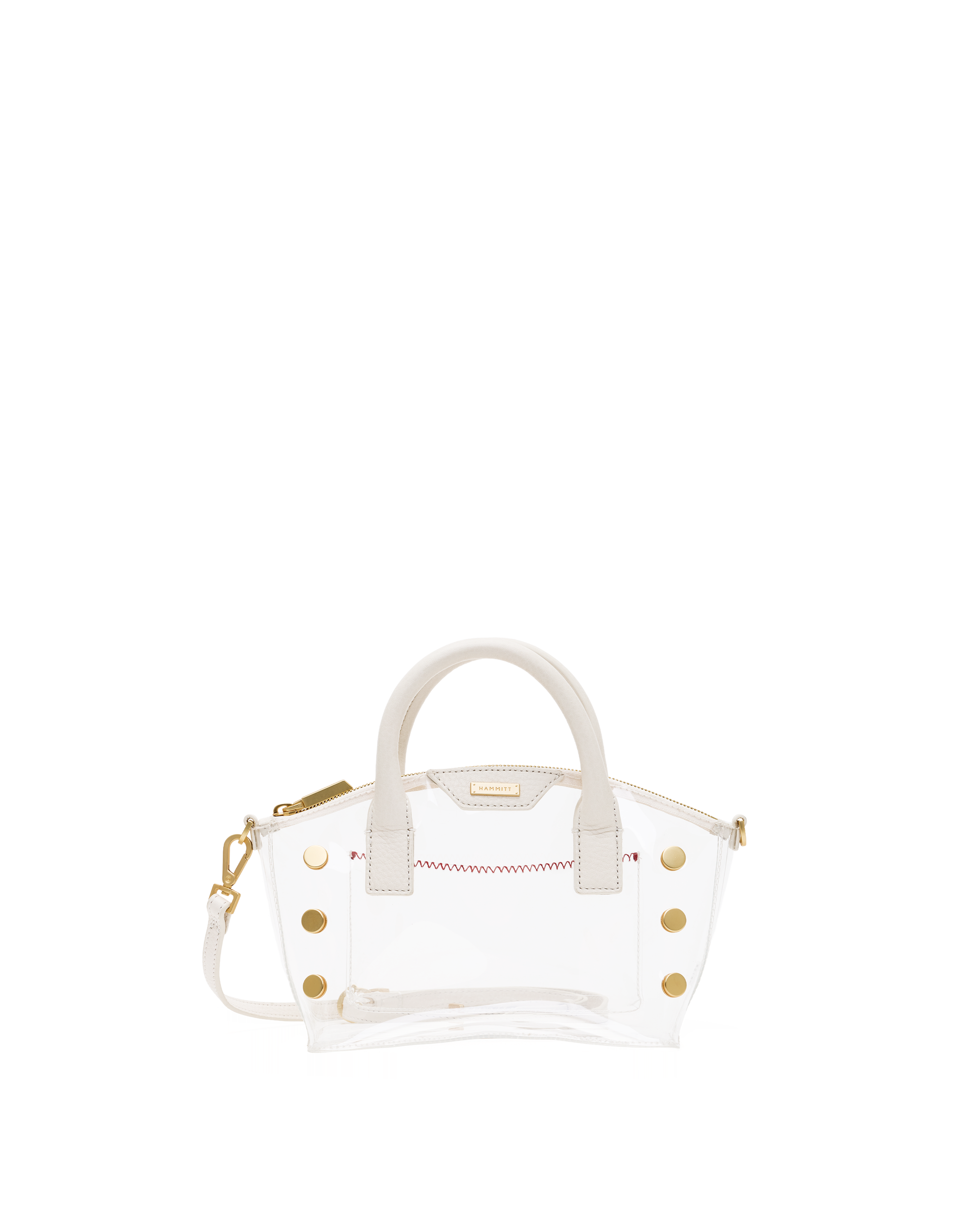 A clear acrylic handbag with white faux-leather trim, gold-tone hardware, and a white top handle.