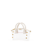A small structured handbag with a transparent white body, cream-colored top handles, and gold-tone hardware, including decorative studs and a zipper pull.