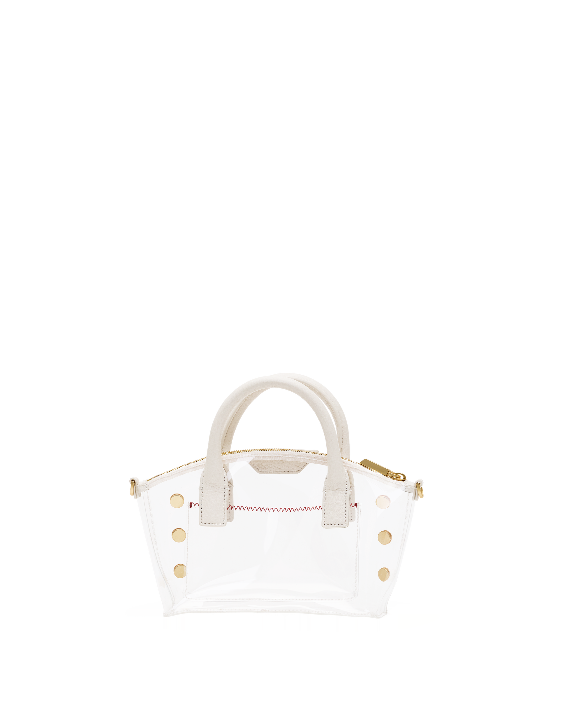 A clear vinyl handbag with cream-colored handles and trim, accented by gold-tone studs and a red stitched detail on the front.