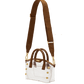 A structured white tote bag with brown leather handles and trim, featuring gold-tone hardware and a matching brown shoulder strap with embossed lettering.