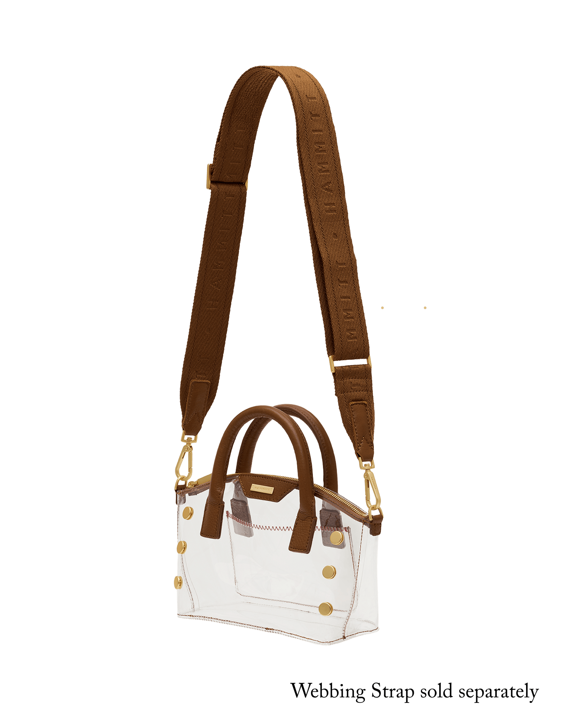 A structured white tote bag with brown leather handles and trim, featuring gold-tone hardware and a matching brown shoulder strap with embossed lettering.