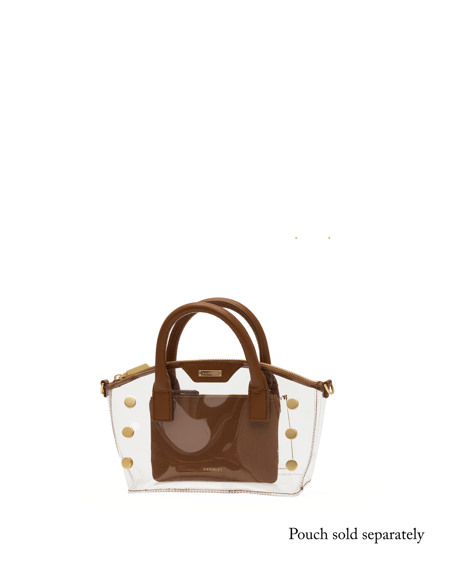 A structured handbag with a glossy brown front panel and handles, combined with a clear transparent side panel decorated with gold-tone studs.