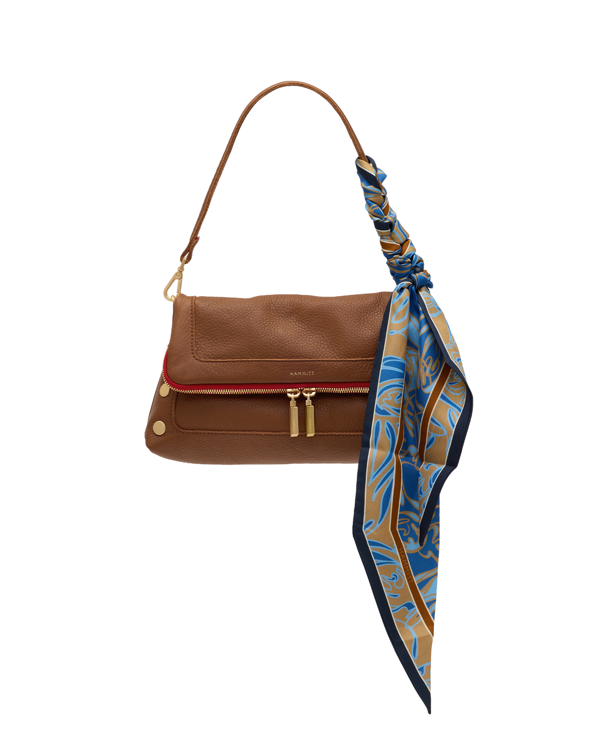 A brown leather shoulder bag with a red accent stripe along the front zipper, gold-tone hardware, and a blue, gold, and navy patterned silk scarf tied to the strap, shown on a plain white background.