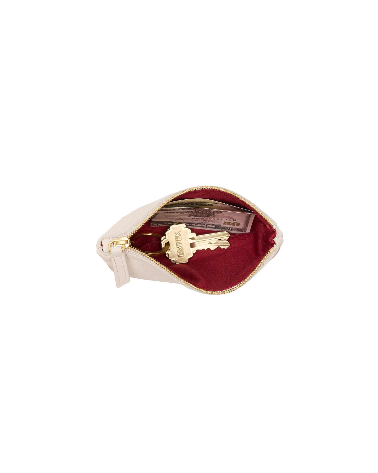 A cream-colored leather key pouch with a gold zipper, shown open to reveal a deep burgundy velvet interior containing a gold key and a card.