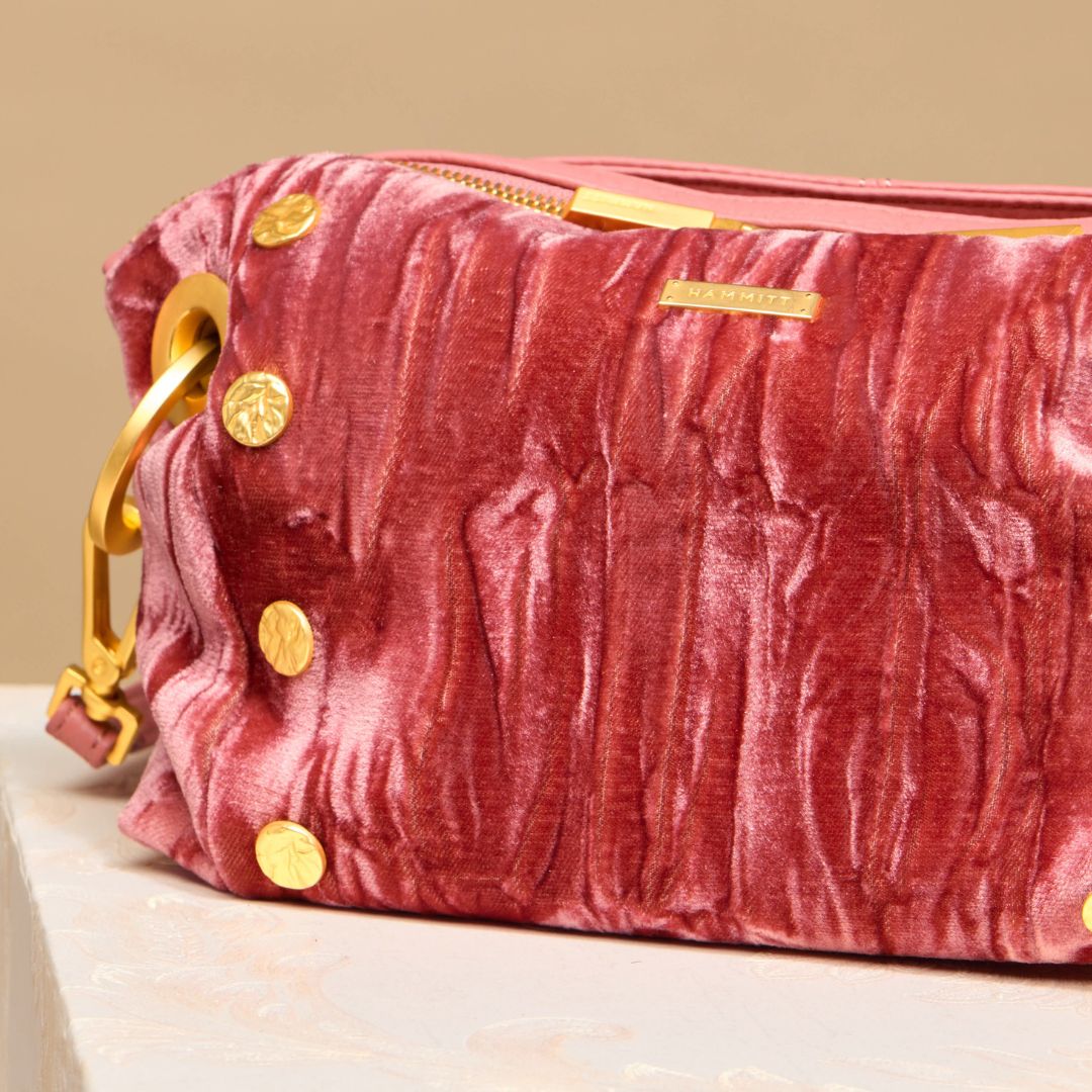 Daniel Crossobyd Clutch Sml in Curtian Call Pink hammered gold on pedestal. 