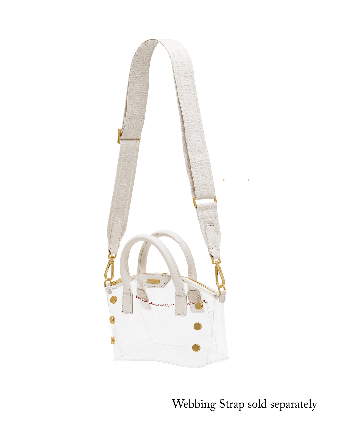 A white structured handbag with double top handles, a long matching shoulder strap, and gold-tone hardware.