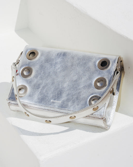 Image of Sidewalk Silver montana clutch sml on white stairs
