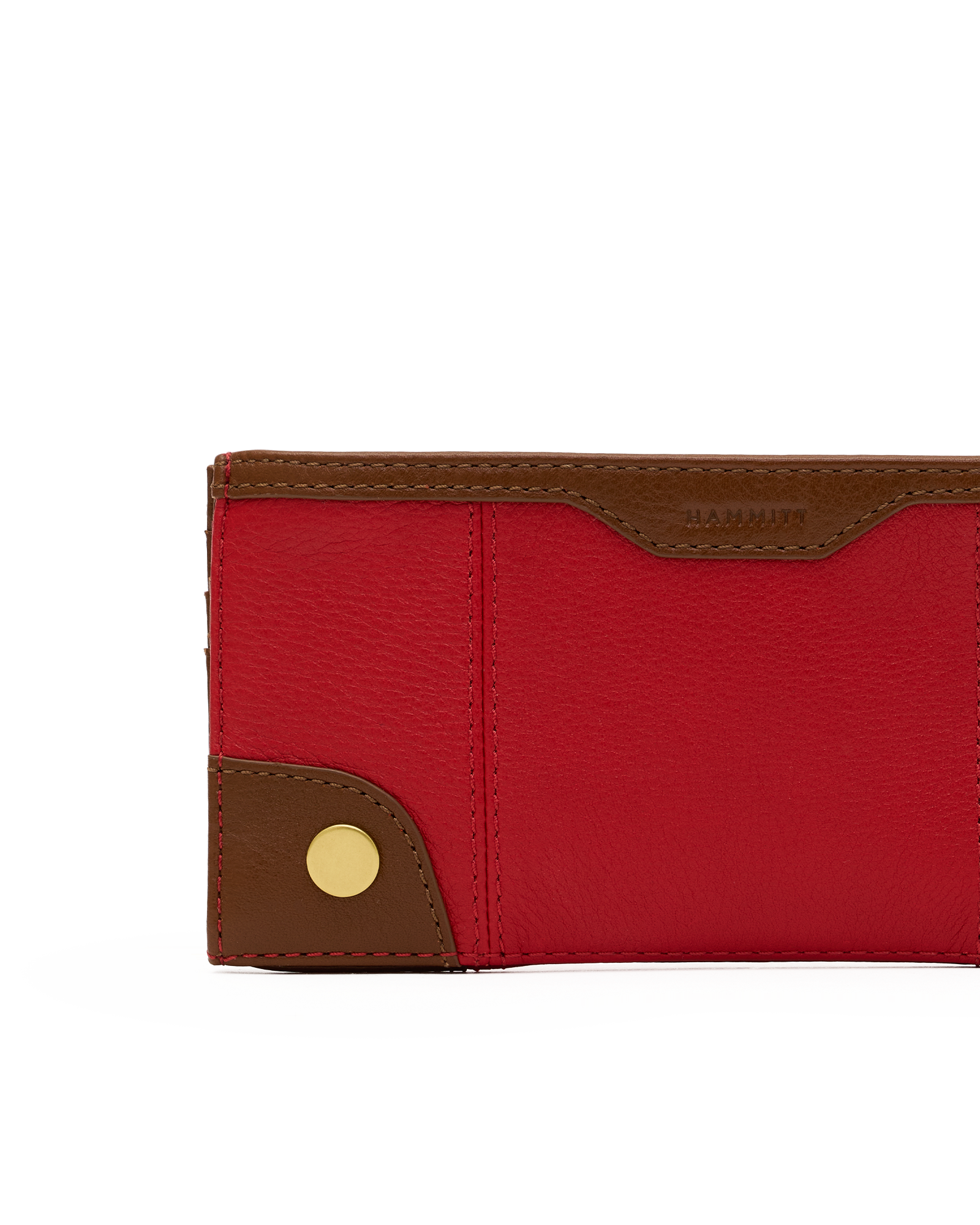 A close-up of a red pebbled leather wallet with brown leather trim and a gold snap button, on a white background.
