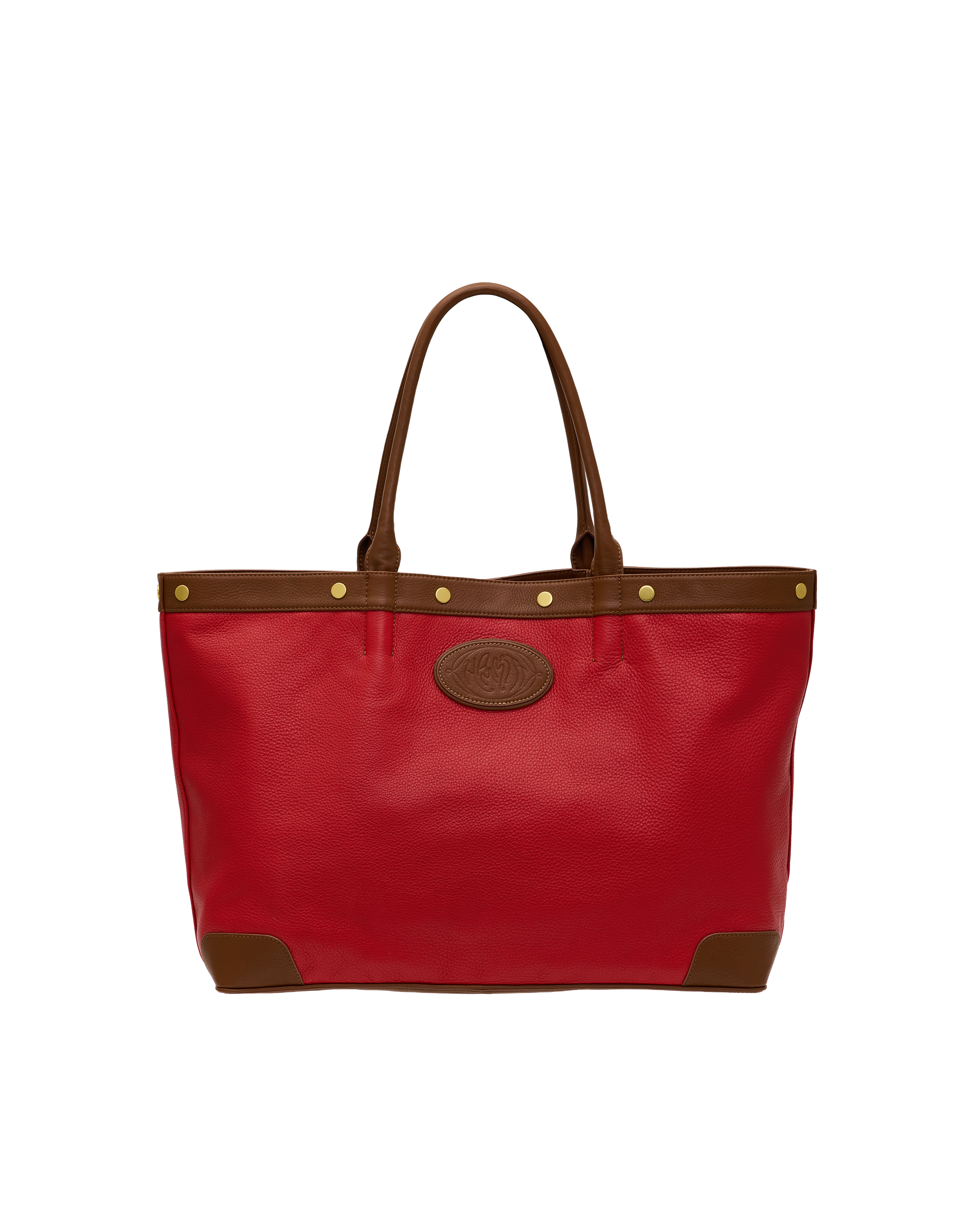 A red leather tote bag with brown leather trim, double shoulder straps, brass-tone hardware, and a circular embossed logo patch on the front, shown against a plain white background.