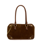 A brown suede and leather handbag with double top handles, gold-tone hardware, and a gold chain strap
