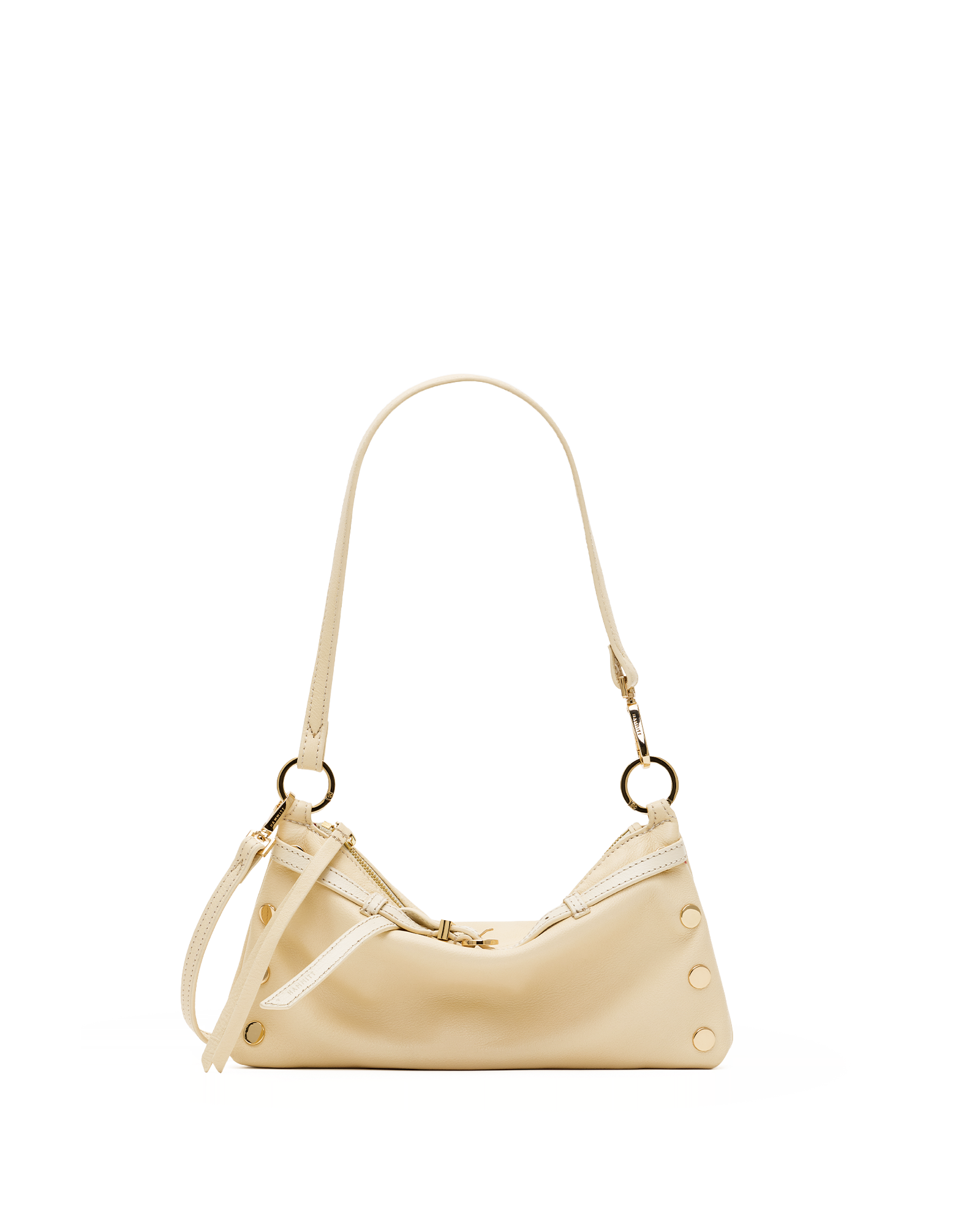 A cream-colored leather shoulder bag with a crescent shape, gold-tone hardware, and a matching shoulder strap, shown against a plain white background.