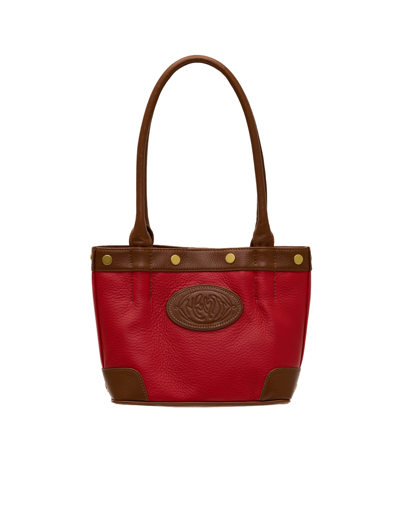 A red pebbled leather handbag with brown leather trim, double top handles, gold-tone rivets, and a brown embossed oval logo patch on the front, shown against a plain white background.