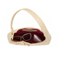An open cream-colored leather shoulder bag with a burgundy interior, shown against a plain white background. Inside, a pair of sunglasses and a small white cosmetic pouch are visible.