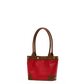 A red leather tote bag with brown leather handles, trim, and corner protectors, accented by gold-tone metal studs, shown against a plain white background.