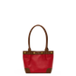 A red leather handbag with brown leather handles, trim, and corner accents, accented by gold-tone rivets, shown against a plain white background.