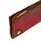 A close-up of a Barrie leather wallet in red and brown with gold-tone hardware, showing the interior card slots and zipper.