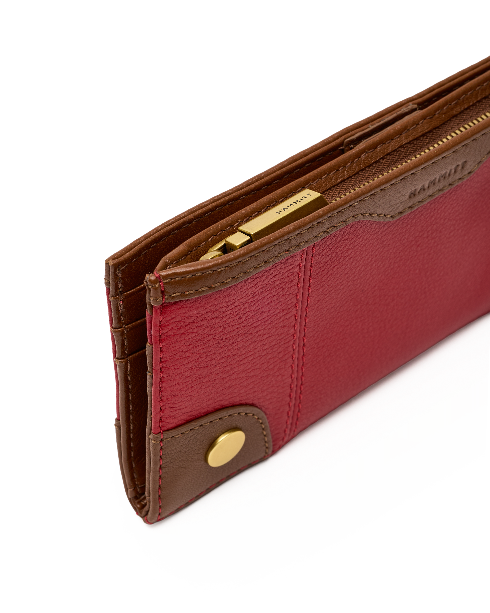 A close-up of a Barrie leather wallet in red and brown with gold-tone hardware, showing the interior card slots and zipper.