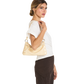 A woman wearing a white short-sleeve top and dark brown pinstriped trousers carries a light beige leather shoulder bag with gold-tone hardware against a plain white background.