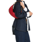 A model wearing a dark blue denim jacket and matching wide-leg jeans, carrying a bright red round shoulder bag with a gold chain strap over her shoulder, against a plain white background.